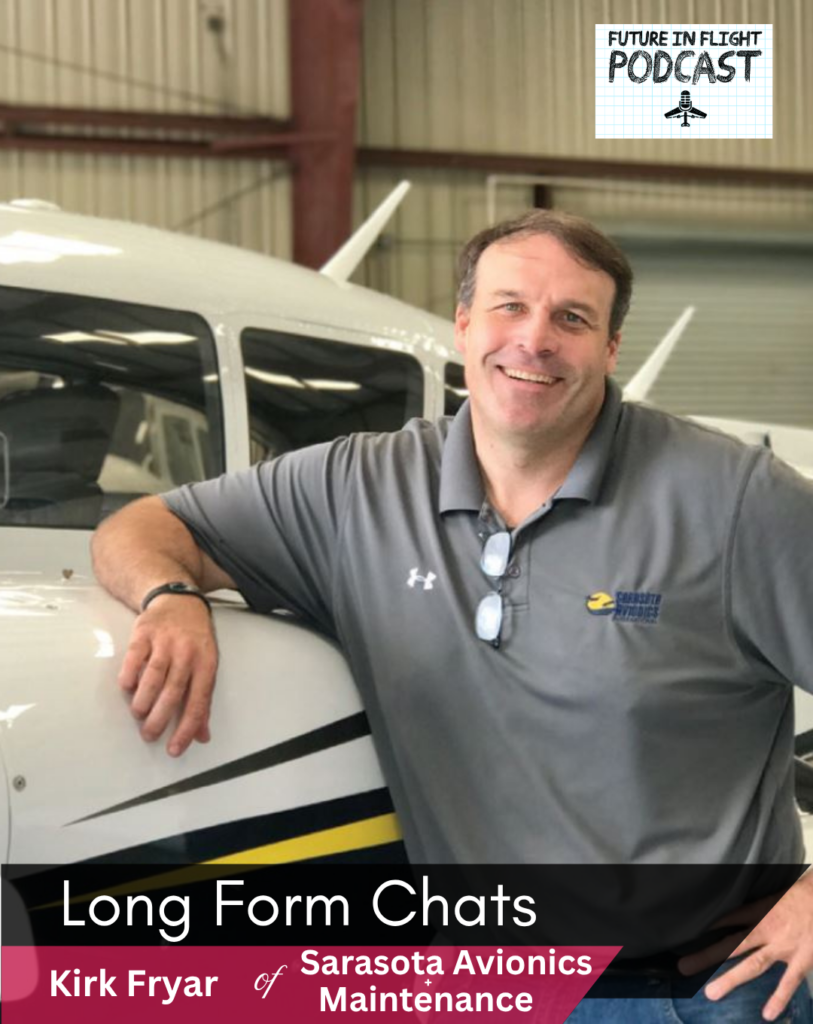 Kirk Fryar of Sarasota Avionics and Maintainence poses with one of his company aircraft inside of the hangar.